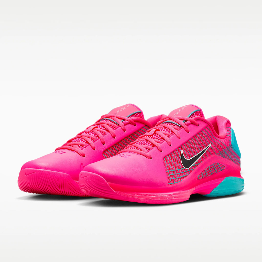Pink Nike shoes with a black swoosh logo on a white background
